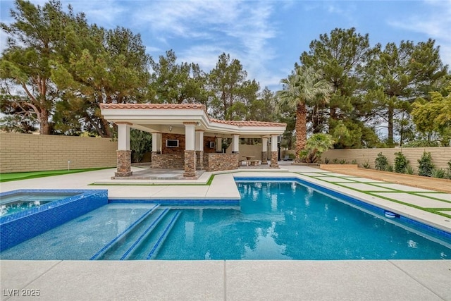 81 Quail Run Rd, Henderson, NV 89014 - view of swimming pool featuring a patio, a fenced backyard, a pool with connected hot tub, and an outdoor structure