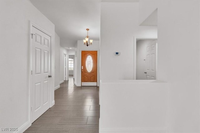 658 Turtleback Dr, North Las Vegas, NV 89031 - foyer featuring a chandelier and wood finished floors