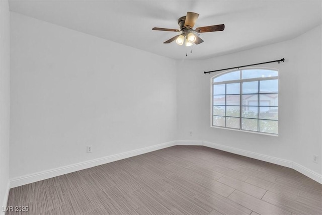 658 Turtleback Dr, North Las Vegas, NV 89031 - spare room featuring a ceiling fan and dark wood-type flooring