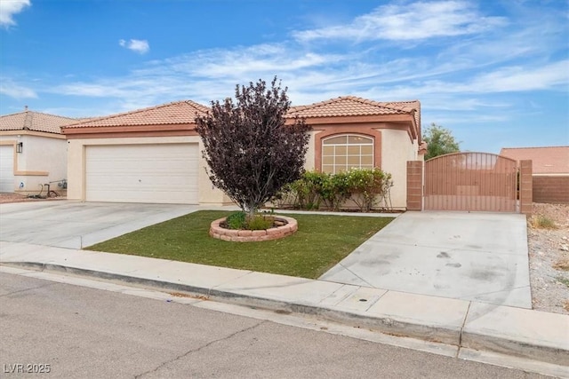 658 Turtleback Dr, North Las Vegas, NV 89031 - mediterranean / spanish-style home with concrete driveway, a gate, stucco siding, a tile roof, and a front yard