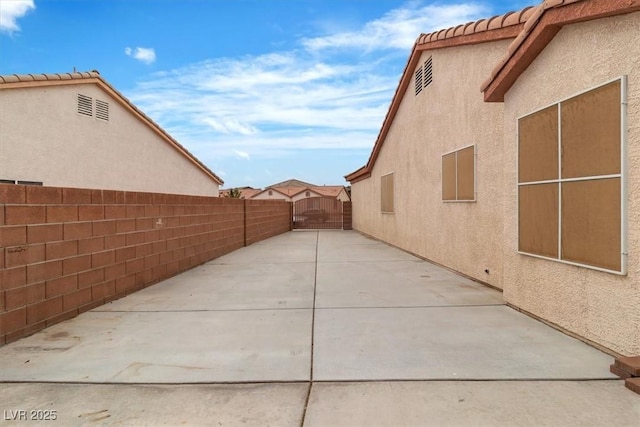 658 Turtleback Dr, North Las Vegas, NV 89031 - fenced backyard with a patio
