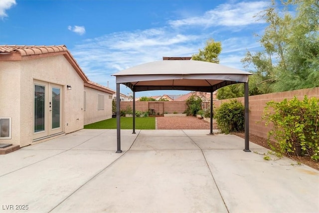 658 Turtleback Dr, North Las Vegas, NV 89031 - fenced backyard featuring a patio area, a gazebo, and french doors