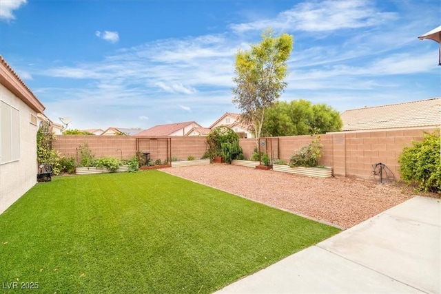 658 Turtleback Dr, North Las Vegas, NV 89031 - fenced backyard featuring a garden and a patio
