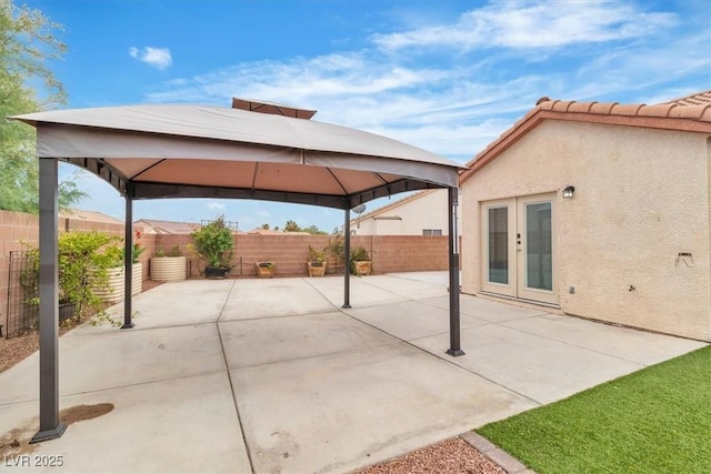 658 Turtleback Dr, North Las Vegas, NV 89031 - fenced backyard with a gazebo, french doors, and a patio