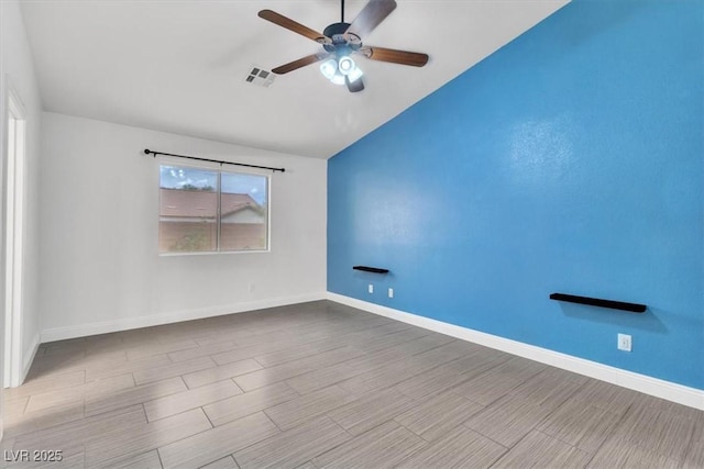 658 Turtleback Dr, North Las Vegas, NV 89031 - empty room with a ceiling fan, lofted ceiling, and wood finished floors