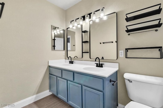 658 Turtleback Dr, North Las Vegas, NV 89031 - bathroom with double vanity and wood finished floors