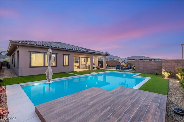 186 Vista Balla Ave, Las Vegas, NV 89138 - pool at dusk with a fenced backyard and a patio area