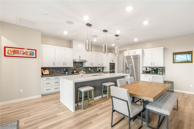 186 Vista Balla Ave, Las Vegas, NV 89138 - dining space with light wood-style flooring and recessed lighting