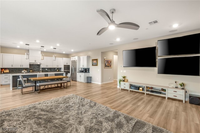 186 Vista Balla Ave, Las Vegas, NV 89138 - living area featuring recessed lighting, light wood-style floors, and a ceiling fan