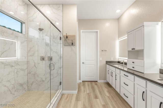 186 Vista Balla Ave, Las Vegas, NV 89138 - full bath with a marble finish shower, wood finished floors, and double vanity