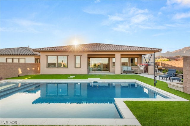 186 Vista Balla Ave, Las Vegas, NV 89138 - back of house with a fenced backyard, a patio, stucco siding, outdoor lounge area, and a tiled roof