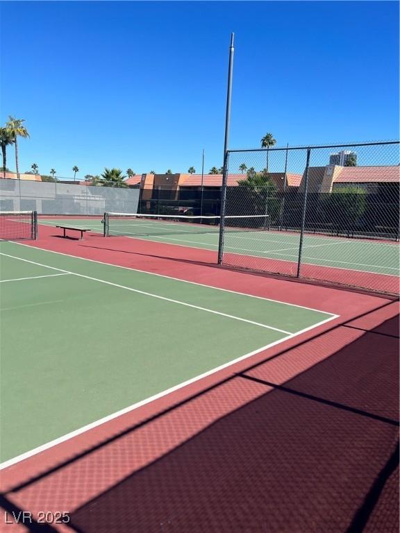 5350 River Glen Dr Unit 298, Las Vegas, NV 89103 - view of tennis court featuring community basketball court