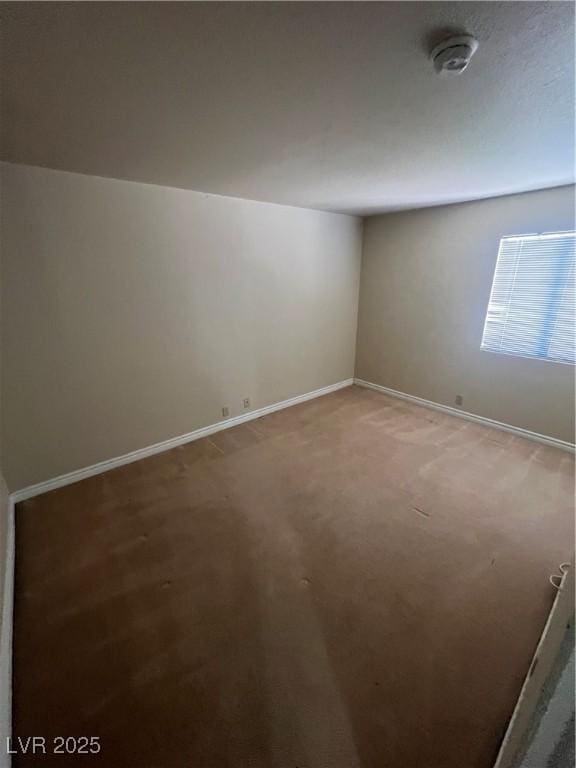 5350 River Glen Dr Unit 298, Las Vegas, NV 89103 - carpeted spare room with baseboards and a smoke detector