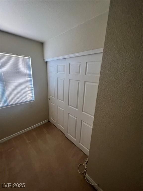 5350 River Glen Dr Unit 298, Las Vegas, NV 89103 - unfurnished bedroom featuring a closet and carpet floors