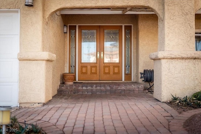 2917 Chapala Dr, Las Vegas, NV 89120 - property entrance with french doors and stucco siding