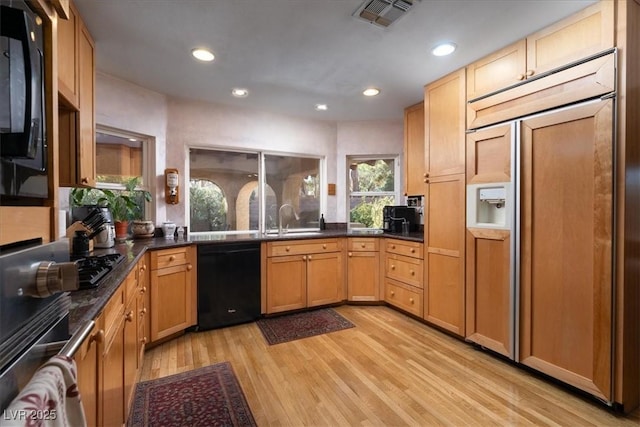 2917 Chapala Dr, Las Vegas, NV 89120 - kitchen featuring black appliances, recessed lighting, light wood-style flooring, and dark countertops