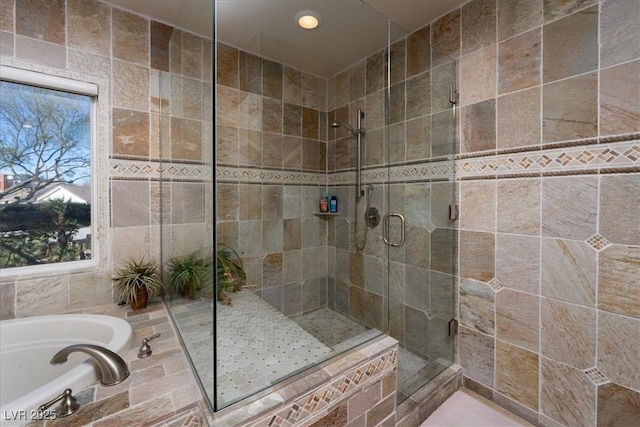 2917 Chapala Dr, Las Vegas, NV 89120 - full bathroom featuring a shower stall, a bath, recessed lighting, and tile walls