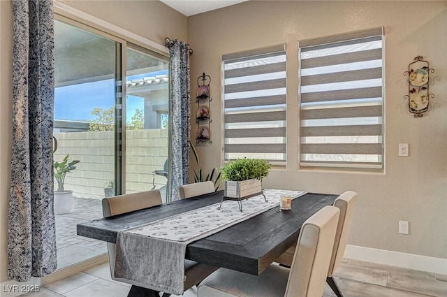 9940 Heather Moore Ave, Las Vegas, NV 89166 - dining space with baseboards and wood finished floors