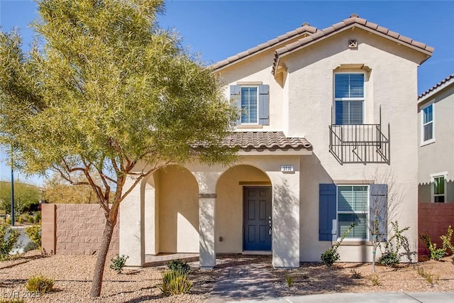 3116 Paladi Ave, Henderson, NV 89044 - mediterranean / spanish-style home featuring a tile roof, stucco siding, and a balcony