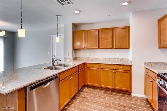 3116 Paladi Ave, Henderson, NV 89044 - kitchen with stainless steel appliances, a peninsula, light wood-style floors, decorative light fixtures, and brown cabinets