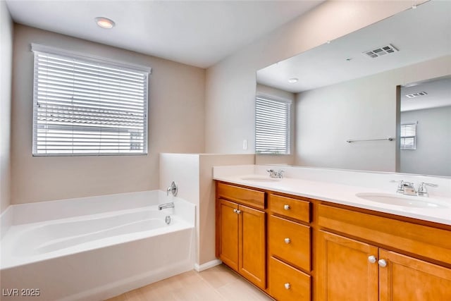 3116 Paladi Ave, Henderson, NV 89044 - bathroom featuring a bath, double vanity, and plenty of natural light