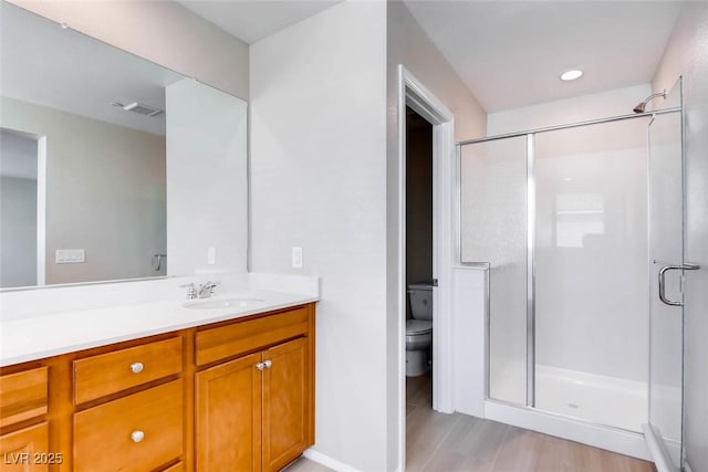 3116 Paladi Ave, Henderson, NV 89044 - full bath featuring vanity, a stall shower, and wood finished floors