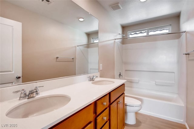 3116 Paladi Ave, Henderson, NV 89044 - full bath featuring washtub / shower combination, double vanity, and wood finished floors