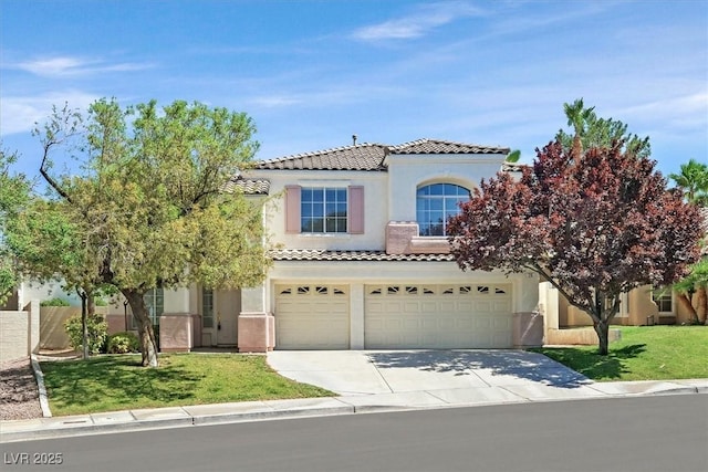 20 Staghorn St, Henderson, NV 89012 - mediterranean / spanish home featuring a tile roof, a garage, stucco siding, and driveway