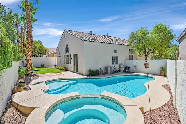 20 Staghorn St, Henderson, NV 89012 - view of swimming pool with a fenced backyard and a pool with connected hot tub