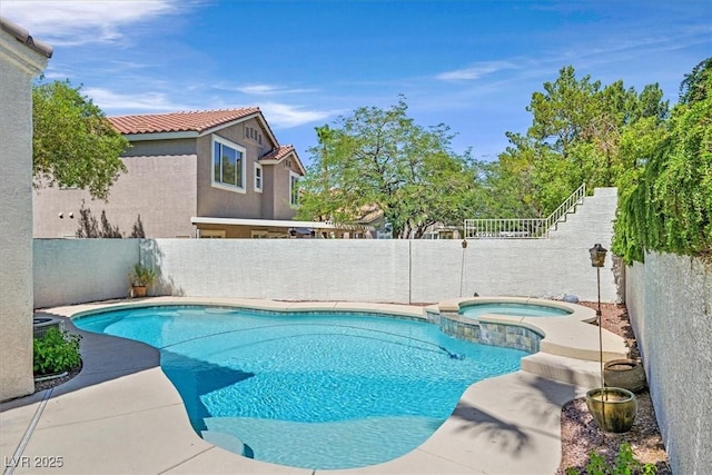 20 Staghorn St, Henderson, NV 89012 - view of pool with a fenced backyard and a pool with connected hot tub