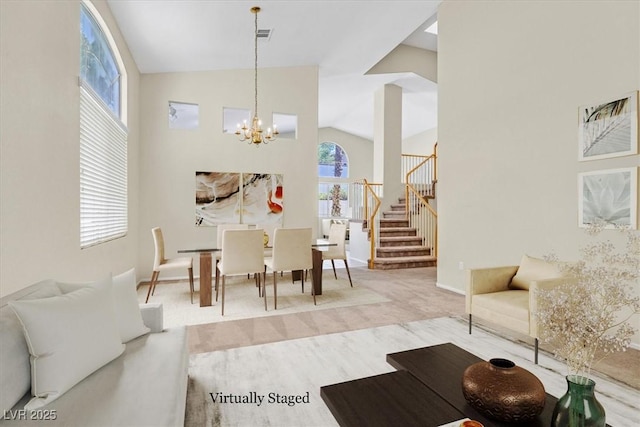 20 Staghorn St, Henderson, NV 89012 - living room with a chandelier, vaulted ceiling, stairway, and wood finished floors