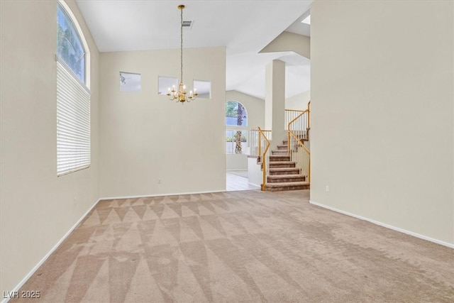 20 Staghorn St, Henderson, NV 89012 - unfurnished room with carpet flooring, lofted ceiling, a chandelier, and stairs