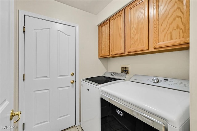 20 Staghorn St, Henderson, NV 89012 - laundry room featuring washing machine and clothes dryer, cabinet space, and light tile patterned flooring