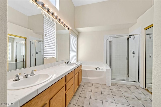 20 Staghorn St, Henderson, NV 89012 - bathroom with a bath, a shower stall, double vanity, and tile patterned floors