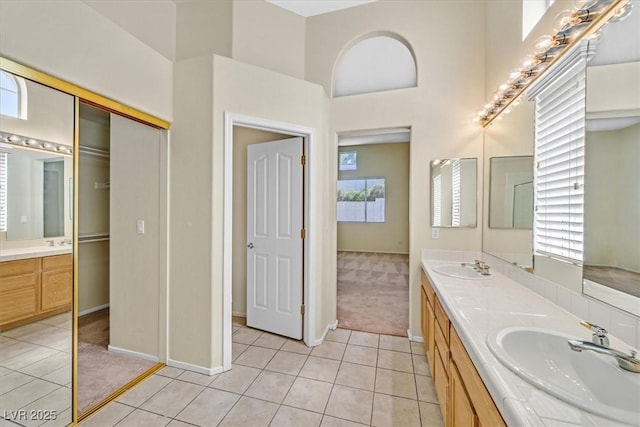 20 Staghorn St, Henderson, NV 89012 - full bath with tile patterned flooring, double vanity, and a high ceiling