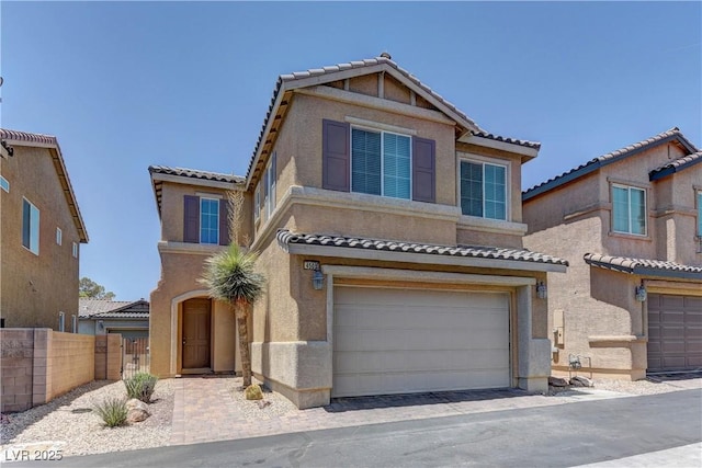 4505 Truscott Ct, Las Vegas, NV 89130 - view of front facade featuring a tile roof, an attached garage, and stucco siding