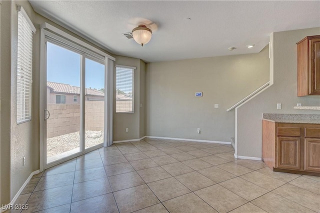 4505 Truscott Ct, Las Vegas, NV 89130 - unfurnished room with light tile patterned flooring and baseboards