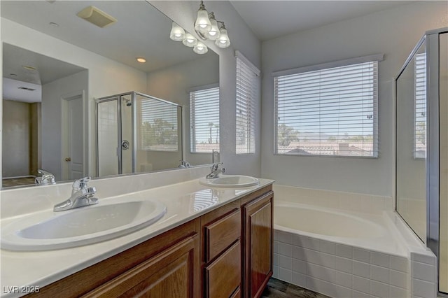 4505 Truscott Ct, Las Vegas, NV 89130 - bathroom featuring a stall shower, a garden tub, and double vanity