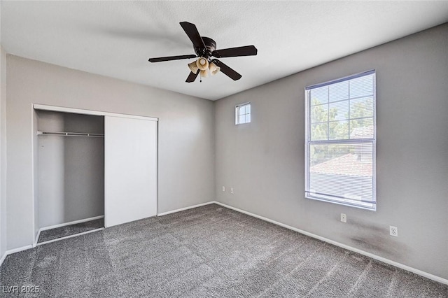 8555 W Russell Rd Unit 2015, Las Vegas, NV 89113 - unfurnished bedroom with carpet flooring, a closet, and a ceiling fan
