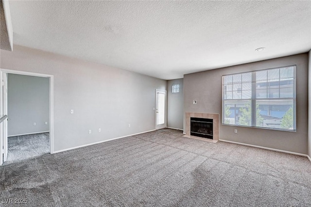 8555 W Russell Rd Unit 2015, Las Vegas, NV 89113 - unfurnished living room with carpet, a textured ceiling, and a fireplace