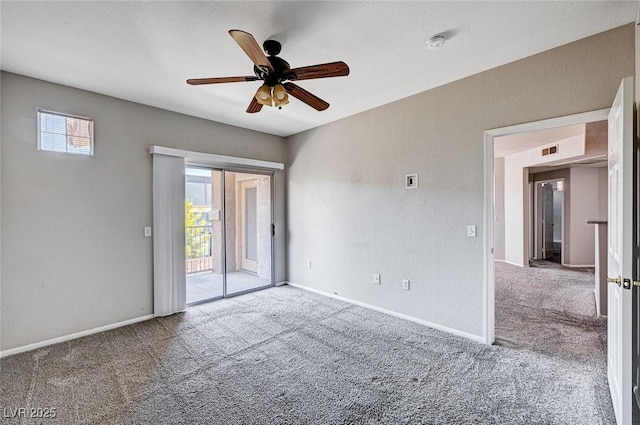 8555 W Russell Rd Unit 2015, Las Vegas, NV 89113 - carpeted spare room featuring plenty of natural light, ceiling fan, and a smoke detector