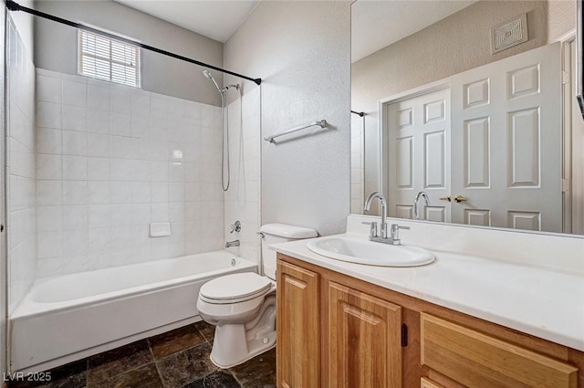 8555 W Russell Rd Unit 2015, Las Vegas, NV 89113 - bathroom featuring a textured wall, vanity, shower / bath combination, and stone finish flooring