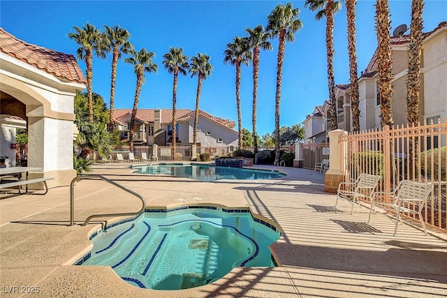 8555 W Russell Rd Unit 2015, Las Vegas, NV 89113 - community pool with a hot tub, a patio, and a residential view