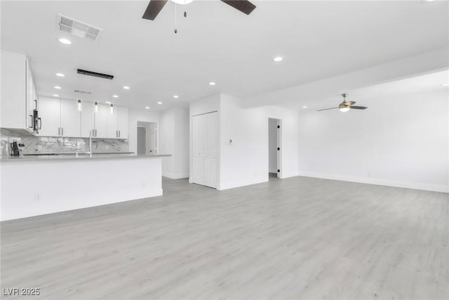 244 N 19th St, Las Vegas, NV 89101 - unfurnished living room featuring a ceiling fan, recessed lighting, and light wood-type flooring