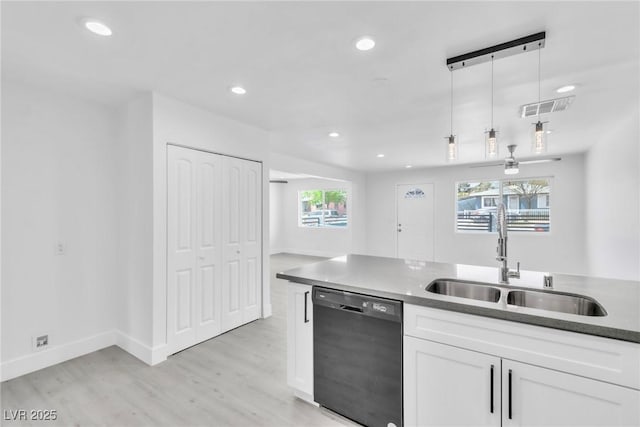 244 N 19th St, Las Vegas, NV 89101 - kitchen featuring dishwasher, light wood-style flooring, white cabinets, recessed lighting, and decorative light fixtures