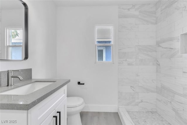 244 N 19th St, Las Vegas, NV 89101 - full bath featuring vanity, wood finished floors, and a tile shower