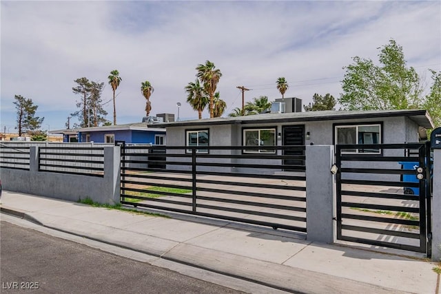 244 N 19th St, Las Vegas, NV 89101 - view of front of property with a gate, a fenced front yard, and stucco siding