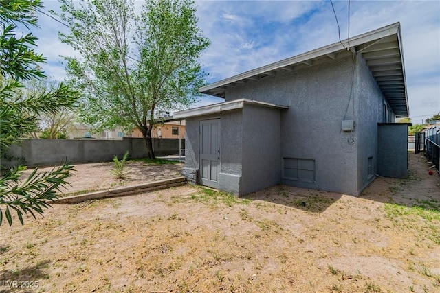 244 N 19th St, Las Vegas, NV 89101 - back of house featuring stucco siding and a fenced backyard