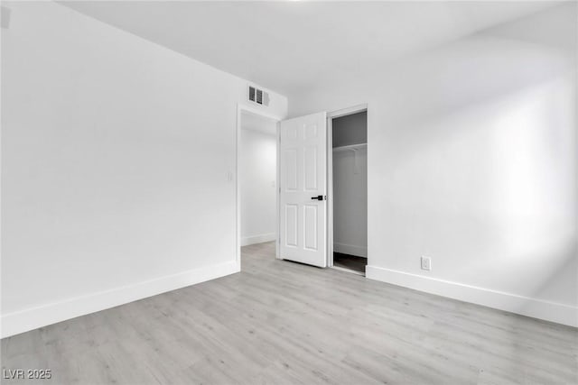 244 N 19th St, Las Vegas, NV 89101 - unfurnished bedroom with wood finished floors and a closet