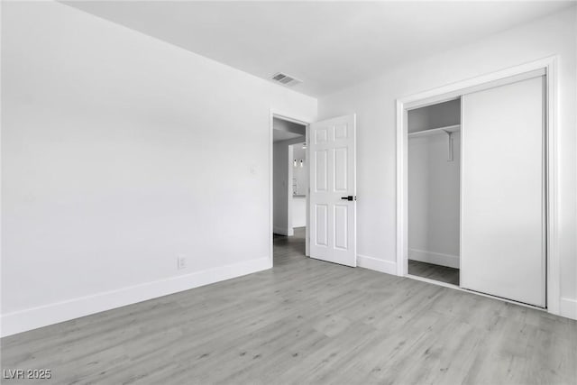 244 N 19th St, Las Vegas, NV 89101 - unfurnished bedroom with wood finished floors and a closet